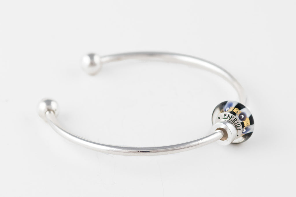 Warrior bead on silver bangle bracelet
